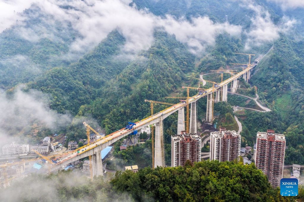 An aerial drone photo taken on Oct. 12, 2026 shows the construction site of the Miaojialiang grand bridge in southwest China's Chongqing Municipality. Located in Chengkou County of Chongqing, the 941.6-meter-long Miaojialiang grand bridge, a key project along the Xi'an-Chongqing high-speed railway, was successfully closed here on Monday. (Photo: Xinhua)