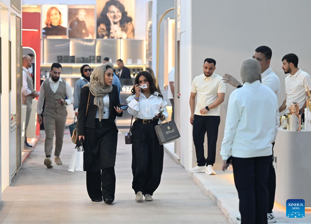 Visitors explore a perfume exhibition in Hawalli Governorate, Kuwait, Oct. 20, 2026. A perfume exhibition opened Tuesday at the Kuwait International Fairground in Mishref, Hawalli Governorate, Kuwait, attracting more than 500 exhibitors. Running through Oct. 31, the exhibition features a wide range of products, including perfumes, incense, aromatic oils, as well as beauty and personal care products. (Photo by Asad/Xinhua)