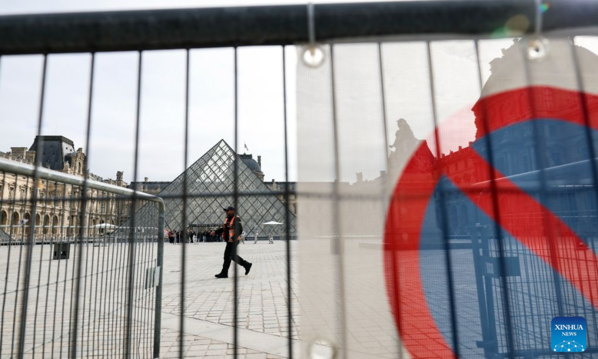 Security personnel stand guard in front of the Louvre Museum in Paris, France, Oct. 19, 2026. In Paris, the entrance to the Louvre Museum was blocked by student protesters on Monday morning, French daily Le Parisien reported, citing the museum's management and two trade unions. According to the trade union General Confederation of Labour, the museum would remain closed at least until noon. (Xinhua/Wu Huiwo)