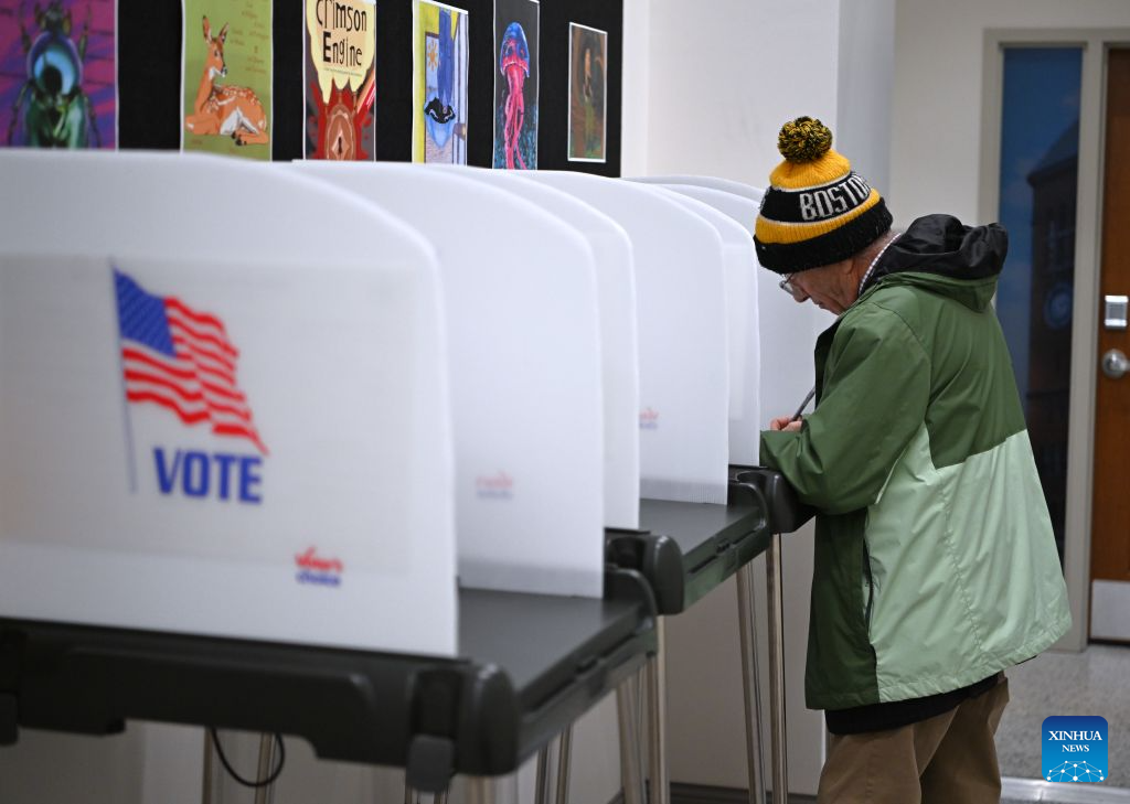 A man fills out his ballot at a polling station in Bangor, Maine, the United States, on Oct. 16, 2026, days before the U.S. midterm elections, which falls on Nov. 3. (Xinhua/Li Rui)