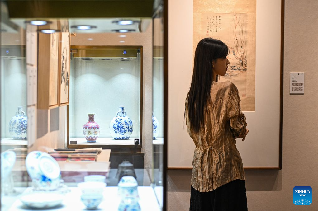 A visitor views artworks at the 2026 Beijing China Art International Fair in Beijing, capital of China, Oct. 20, 2026. With a theme of Cultural Heritage Bridges Life to a Vibrant World, the fair kicked off here on Tuesday. (Xinhua/Chen Zhonghao)