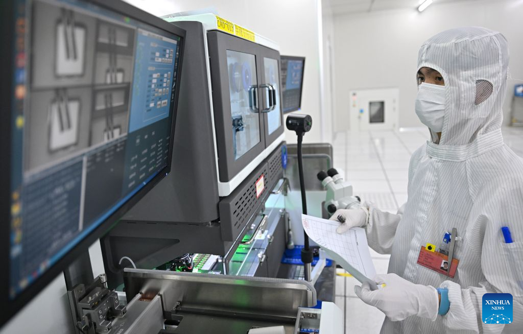 A staff member monitors chip production at a workshop in Hainan Hangxin High-Tech Industrial Park in Haikou, south China's Hainan Province, Oct. 18, 2026.

Leveraging policy benefits and incentives, the Hainan Free Trade Port, under the island-wide special customs operations, is committed to building itself into a hub for Chinese semiconductors and chips to go global. (Xinhua/Guo Cheng)