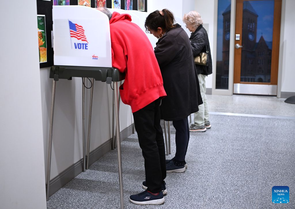People fill out their ballots at a polling station in Bangor, Maine, the United States, on Oct. 16, 2026, days before the U.S. midterm elections, which falls on Nov. 3. (Xinhua/Li Rui)
