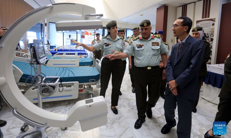 Gong Anmin (1st R), charge d'affaires of the Chinese Embassy in Jordan, checks medical supplies donated by China in Amman, Jordan, Oct. 12, 2026. A Chinese donation of medical supplies was handed over to Jordan's Royal Medical Services on Monday to treat sick and wounded Palestinians who have fled Gaza to Jordan. (Photo: Xinhua)
