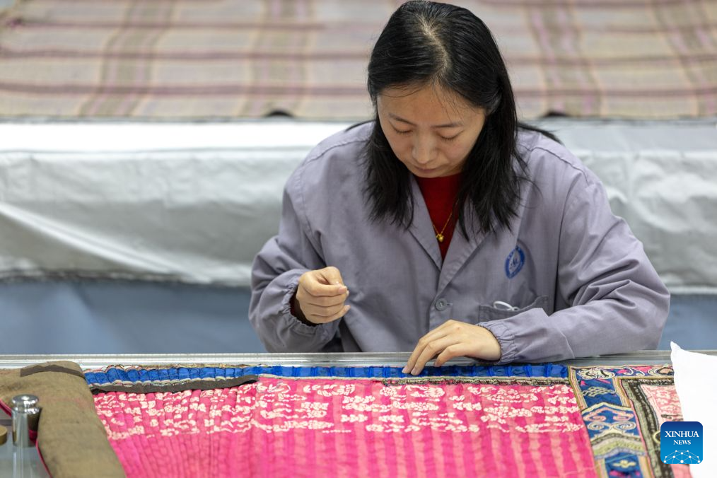 A staff member restores a textile artifact at the cultural relics protection center in Jingzhou, central China's Hubei Province, Oct. 19, 2026.
Established in 2003, the cultural relics protection center in Jingzhou undertakes the conservation of about 80 percent of China's waterlogged bamboo and wooden slips. The center has developed comprehensive conservation techniques for such slips, covering sectors from archaeological excavation and laboratory conservation to display and storage.
To date, the center has provided technical support in cultural relic conservation to more than 130 cultural and museum institutions across the country, and has restored more than 10,000 lacquered wooden artifacts, over 180,000 bamboo and wooden slips, and more than 1,100 textile artifacts. (Xinhua/Xiao Yijiu)