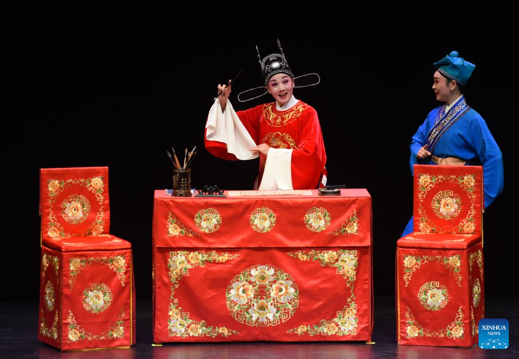 Chinese Huangmei Opera artist Han Zaifen (L) performs in Vienna, Austria, Oct. 15, 2026. (Xinhua/He Canling)