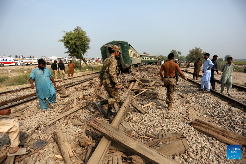 People are seen at the site of a train derailment accident in Multan district of Punjab province, Pakistan, Oct. 13, 2026. At least five passengers were killed and 30 others injured after all 14 carriages of a passenger train derailed in Pakistan's eastern Punjab province early Tuesday morning, police said. (Photo: Xinhua)