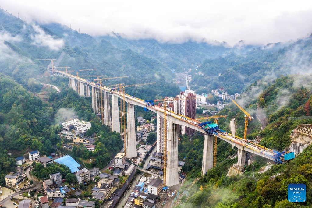 An aerial drone photo taken on Oct. 12, 2026 shows the construction site of the Miaojialiang grand bridge in southwest China's Chongqing Municipality. Located in Chengkou County of Chongqing, the 941.6-meter-long Miaojialiang grand bridge, a key project along the Xi'an-Chongqing high-speed railway, was successfully closed here on Monday. (Photo: Xinhua)