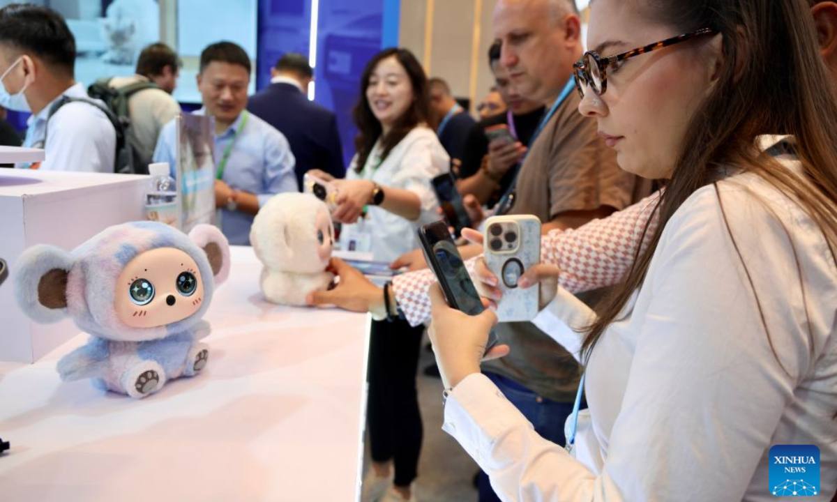 An overseas buyer learns about a companion robot during the Canton Fair in Guangzhou, south China's Guangdong Province, Oct. 15, 2026. The 140th edition of the China Import and Export Fair, also known as the Canton Fair, opened to visitors in Guangzhou, capital of south China's Guangdong Province on Thursday, with more than 30,000 exhibiting companies and about 340,000 overseas buyers expected to attend. Serving as a barometer and wind vane of China's foreign trade, this year's fair, marking its 70th anniversary, features innovation, intelligence, greater specialization and higher quality. The Canton Fair is one of the world's few one-stop trade platforms offering a complete range of products with convenience and efficiency, while bringing together the latest products and technologies. (Xinhua/Lu Hanxin)