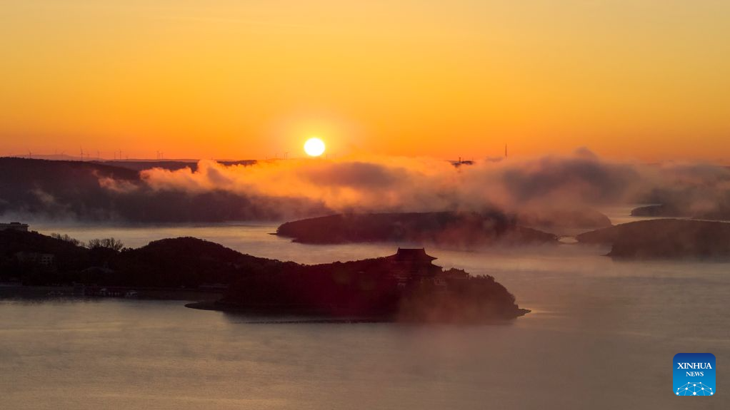 An aerial drone photo taken on Oct. 17, 2026 shows the autumn scenery at sunrise at the Jingpohu Global Geopark in Mudanjiang City, northeast China's Heilongjiang Province. (Photo by Wang Baoxun/Xinhua)