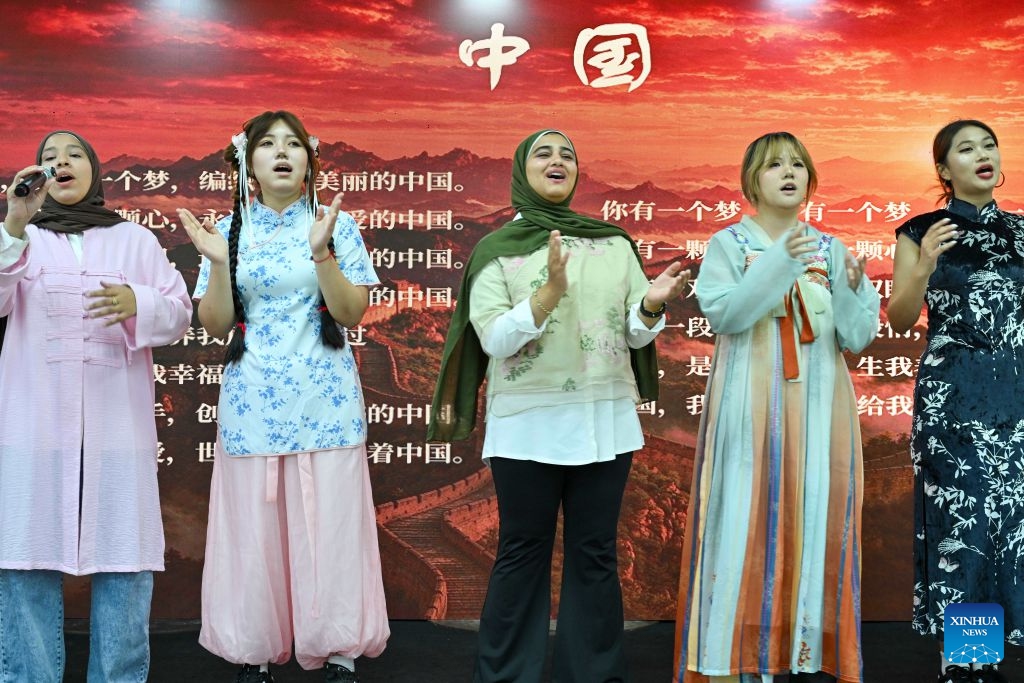Students sing a Chinese song during a Chinese culture festival at Badr University in Cairo, Egypt, Oct. 12, 2026. A Chinese culture festival was held Monday at Badr University in Cairo to celebrate the 70th anniversary of the establishment of diplomatic relations between China and Egypt, featuring cultural performances, traditional Chinese arts and student exchanges. (Photo: Xinhua)