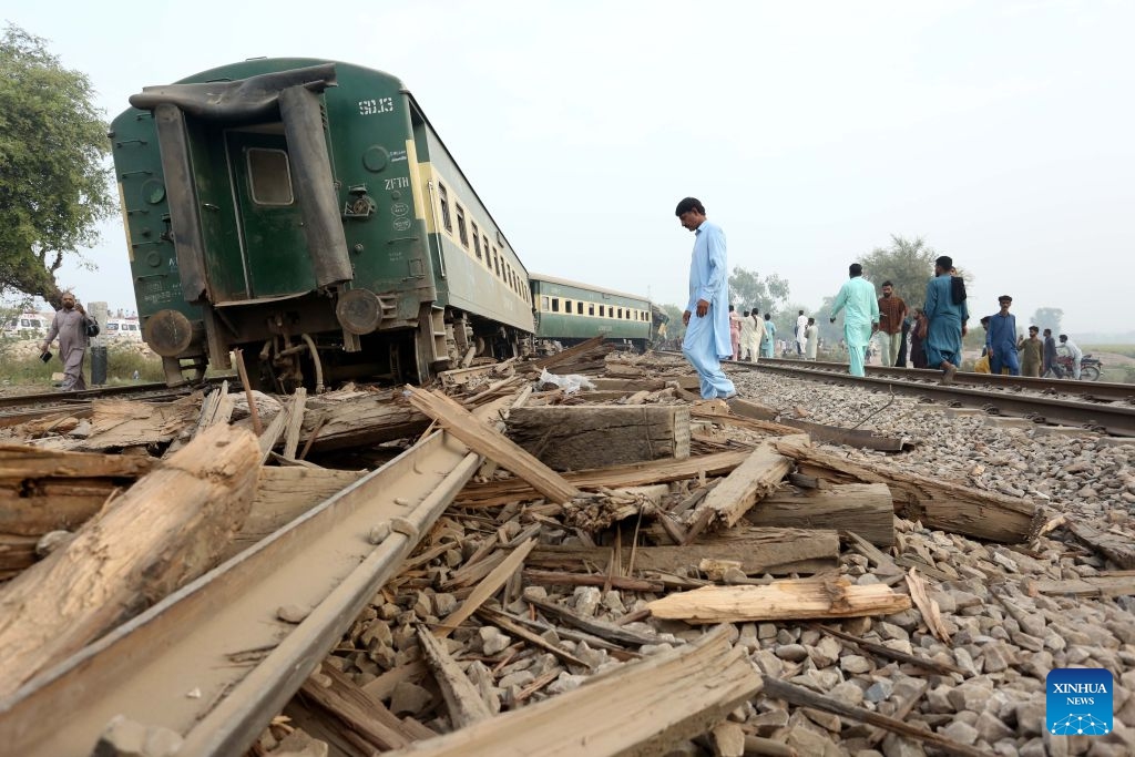 People are seen at the site of a train derailment accident in Multan district of Punjab province, Pakistan, Oct. 13, 2026. At least five passengers were killed and 30 others injured after all 14 carriages of a passenger train derailed in Pakistan's eastern Punjab province early Tuesday morning, police said. (Photo: Xinhua)