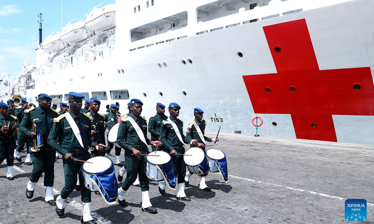 Local honor guards welcome the Chinese People's Liberation Army Navy hospital ship Auspicious Ark upon its arrival in Abidjan, Cote d'Ivoire, Oct. 14, 2026. Auspicious Ark arrived in Abidjan, the economic capital of Cote d'Ivoire, on Wednesday to begin a friendly visit and provide medical services, marking the first visit by a Chinese naval hospital ship to the country. The hospital ship, which is carrying out Mission Harmony-2026, docked at Abidjan at about 10:00 a.m. local time (1000 GMT). (Photo by Yvan Sonh/Xinhua)