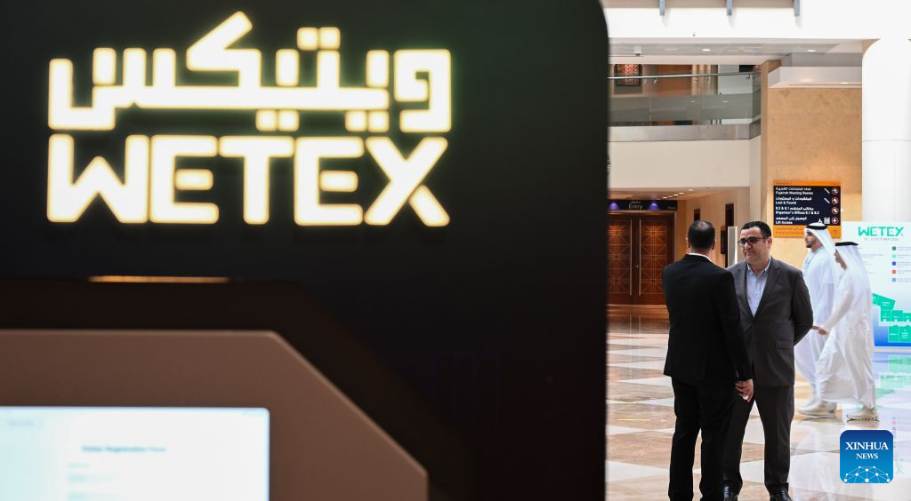 People communicate during the 28th Water, Energy, Technology and Environment Exhibition (WETEX) in Dubai, the United Arab Emirates, Oct. 20, 2026. The 28th WETEX opened Tuesday at the Dubai World Trade Centre in Dubai. (Xinhua/Wang Zecong)