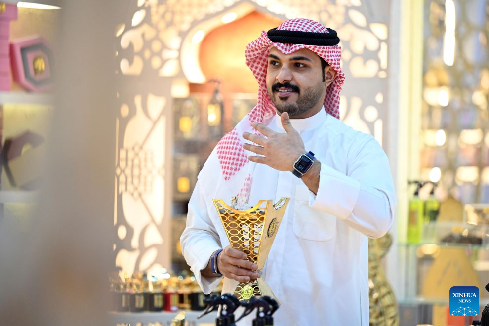 A man burns incense at a perfume exhibition in Hawalli Governorate, Kuwait, Oct. 20, 2026. A perfume exhibition opened Tuesday at the Kuwait International Fairground in Mishref, Hawalli Governorate, Kuwait, attracting more than 500 exhibitors. Running through Oct. 31, the exhibition features a wide range of products, including perfumes, incense, aromatic oils, as well as beauty and personal care products. (Photo by Asad/Xinhua)
