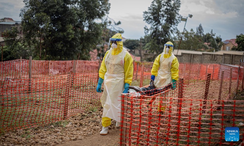 Health workers transport an Ebola patient at an Ebola treatment center in Bunia, capital of Ituri Province in the Democratic Republic of the Congo (DRC), on Oct. 12, 2026. The Democratic Republic of the Congo (DRC) has recorded more than 9,000 confirmed cases of Ebola since the outbreak was declared on May 15, with the death toll rising to 4,381, according to the latest situation report released Tuesday. (Photo: Xinhua)