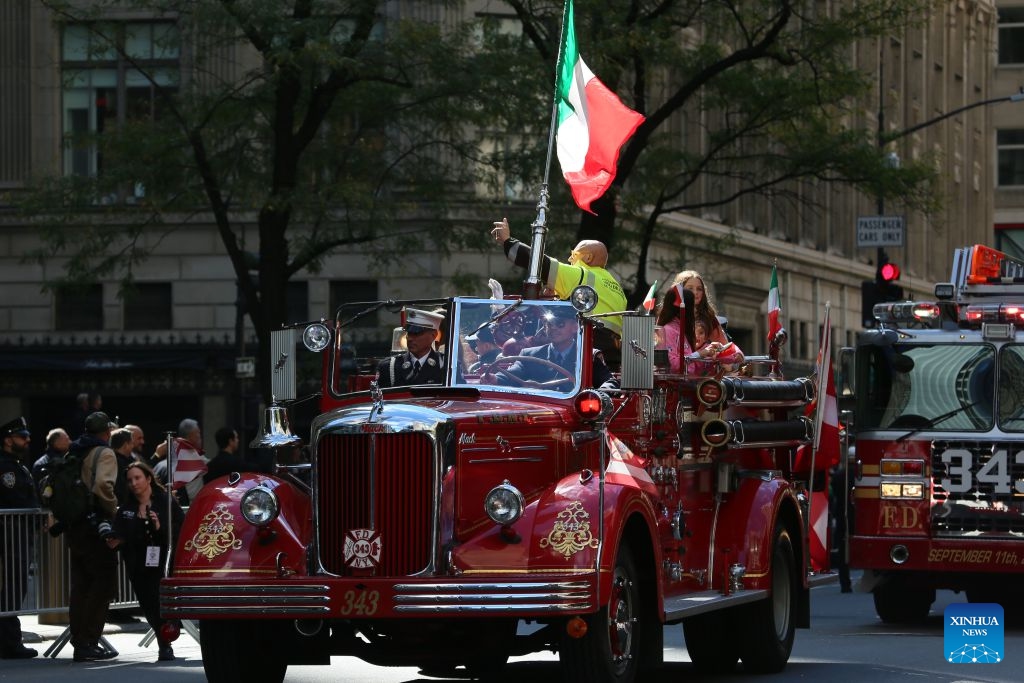 People in a vintage fire truck take part in the Columbus Day parade on Manhattan's Fifth Avenue in New York, the United States, Oct. 12, 2026. The Columbus Day, which marks the landing of the Italian-born explorer Christopher Columbus, was held here on Monday. (Photo: Xinhua)
