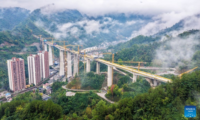 An aerial drone photo taken on Oct. 12, 2026 shows the construction site of the Miaojialiang grand bridge in southwest China's Chongqing Municipality. Located in Chengkou County of Chongqing, the 941.6-meter-long Miaojialiang grand bridge, a key project along the Xi'an-Chongqing high-speed railway, was successfully closed here on Monday. (Photo: Xinhua)