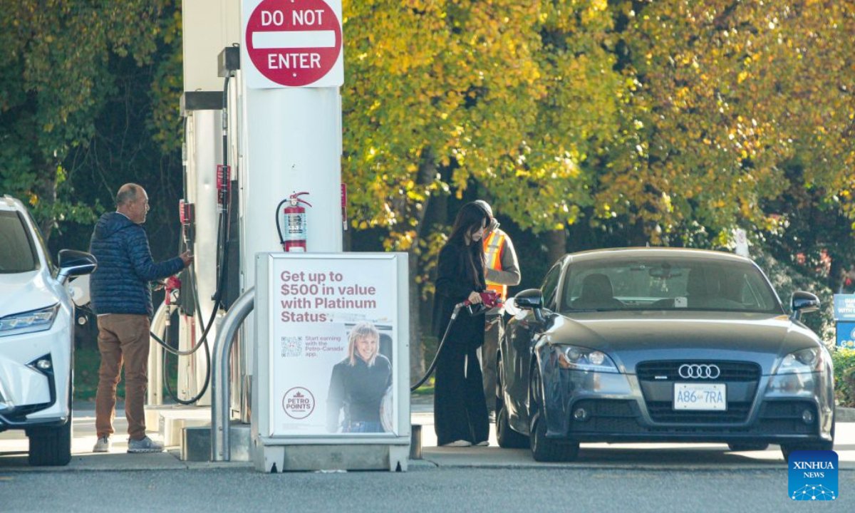 People fuel their cars at a gas station in Vancouver, British Columbia, Canada, on Oct. 19, 2026. Canada's Consumer Price Index (CPI) rose 3.1 percent year over year in September, following a 3-percent increase in August, Statistics Canada said Monday. (Photo by Liang Sen/Xinhua)