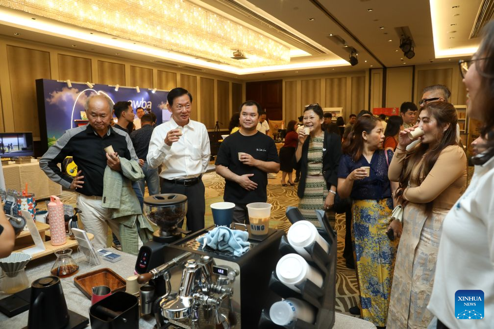 People taste coffee at a booth during the 2026 Myanmar Coffee Festival and Myanmar National Barista Championship in Yangon, Myanmar, Oct. 18, 2026. (Xinhua/Myo Kyaw Soe)