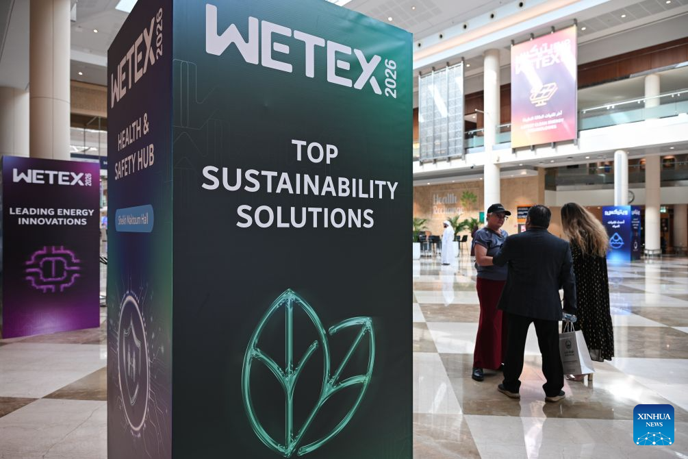 People communicate during the 28th Water, Energy, Technology and Environment Exhibition (WETEX) in Dubai, the United Arab Emirates, Oct. 20, 2026. The 28th WETEX opened Tuesday at the Dubai World Trade Centre in Dubai. (Xinhua/Wang Zecong)