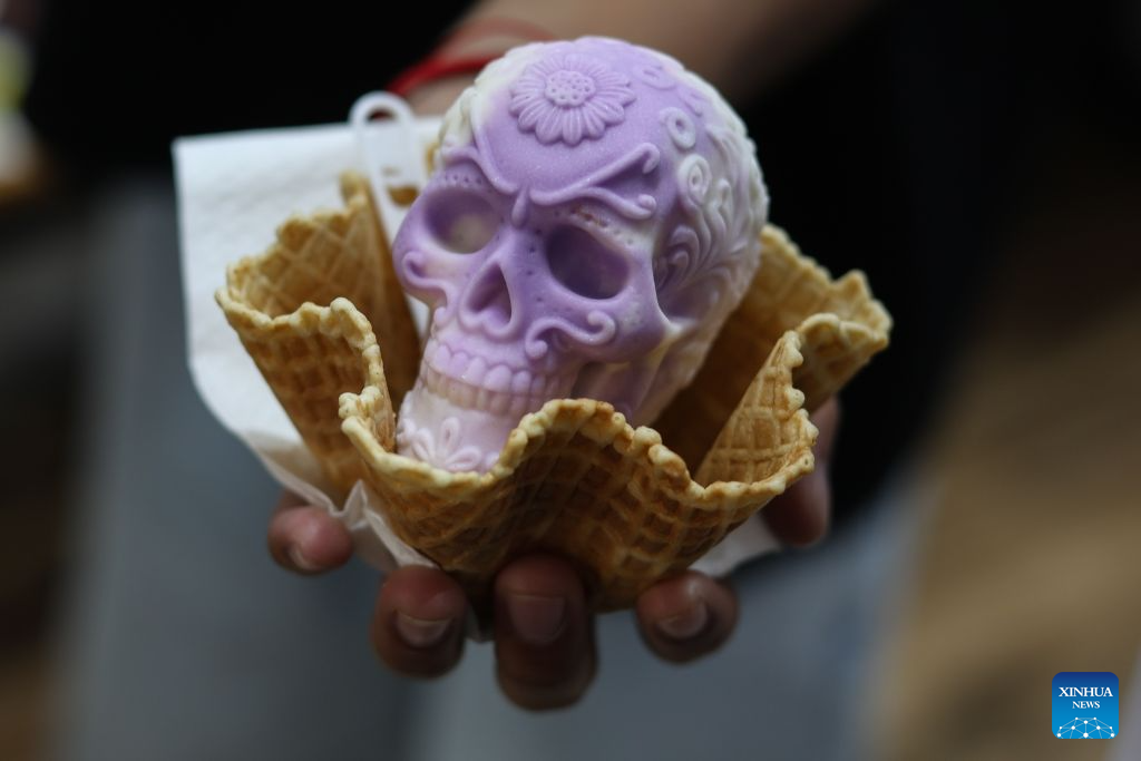 A Catrina-shaped ice cream is seen in Mexico City, capital of Mexico, Oct. 17, 2026. As the Day of the Dead approaches, an ice cream shop in Mexico City has introduced Catrina-shaped ice creams, attracting many local residents and tourists. (Photo by Francisco Canedo/Xinhua)