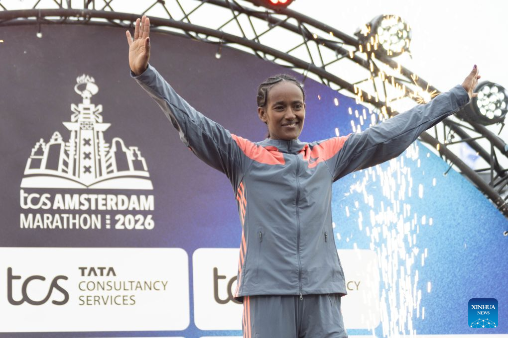 Buze Diriba of Ethiopia is pictured on the podium after winning the women's race of the Amsterdam