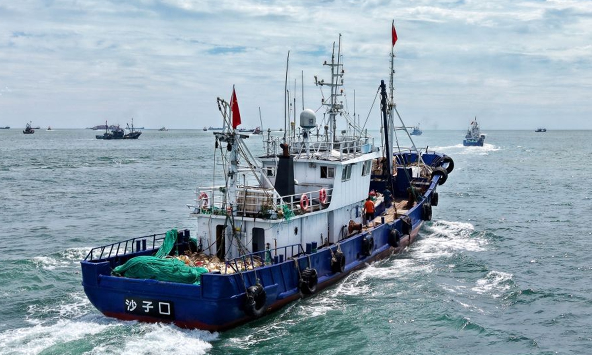 A drone photo taken on Sept. 1, 2026 shows a fishing boat sailing out of a fishing port in Qingdao, East China's Shandong Province. The new fishing season in the Yellow Sea and Bohai Sea kicked off on Tuesday after a four-month summer fishing moratorium. Photo: Xinhua
