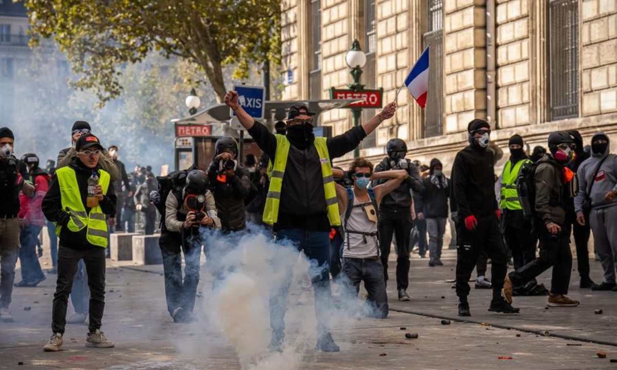 A demonstrator reacts during a protest in Paris, France, Oct. 17, 2026. French Interior Minister Laurent Nunez said Saturday that about 550,000 people took part in the protests across France. (Photo by Aurelien Morissard/Xinhua)