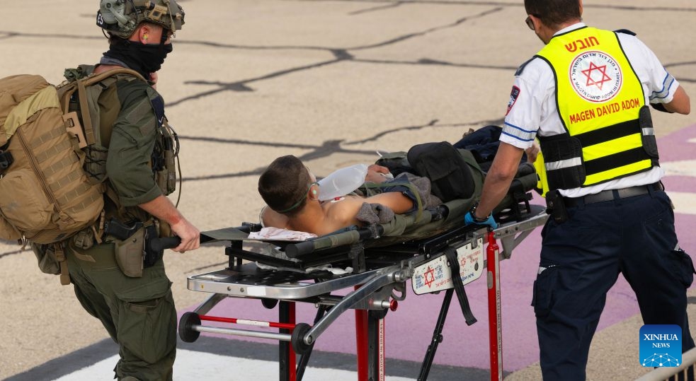 An injured person is transferred to Rambam Hospital in Haifa, northern Israel, Oct. 12, 2026. One person was killed and 19 others injured in an explosion of unexploded ordnance during a school trip in northern Israel on Monday, Israeli police and the national emergency service Magen David Adom said in separate statements. (Photo: Xinhua)