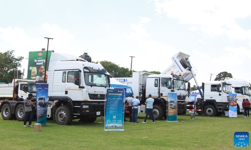 Trucks are displayed at the China-Zimbabwe Commodity Expo and Job Fair in Harare, Zimbabwe, on Oct. 9, 2026. Chinese heavy-duty truck brands attracted strong interest from visitors at the three-day China-Zimbabwe Commodity Expo and Job Fair, which concluded Sunday in the Zimbabwean capital of Harare, reflecting growing local demand for reliable commercial vehicles. (Photo: Xinhua)