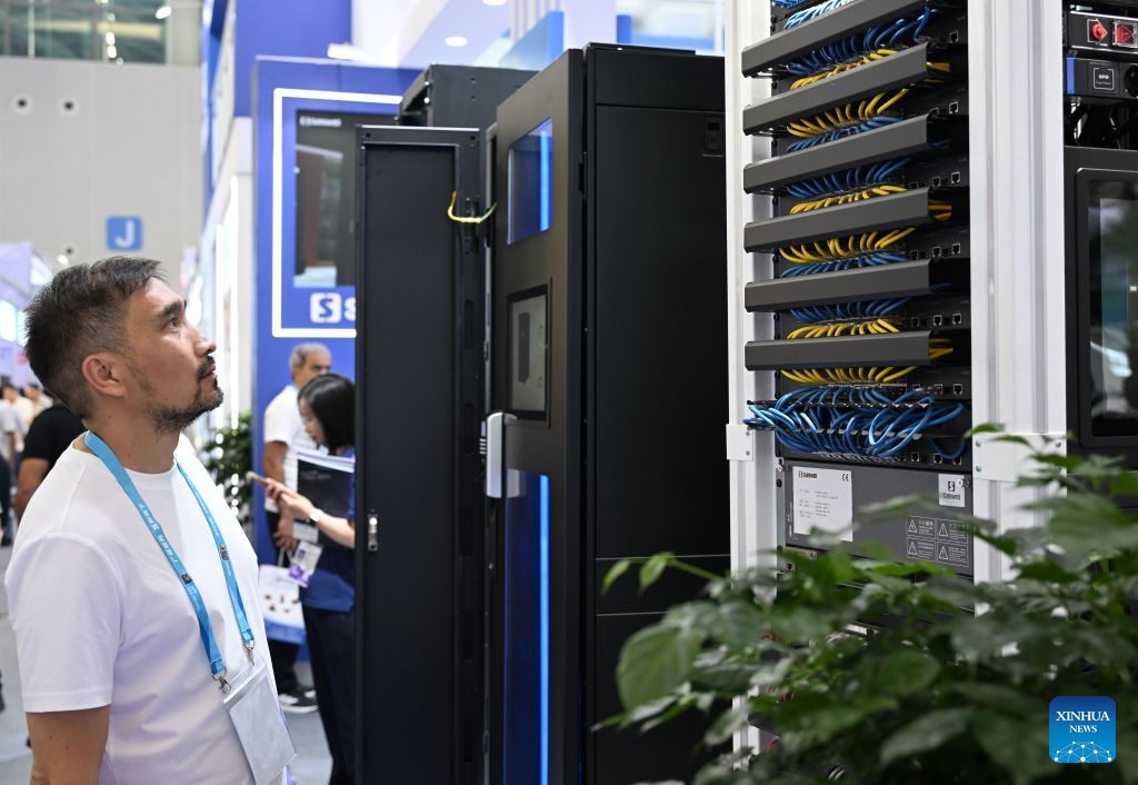 An overseas buyer views a server cabinet produced by Safewell Group, a security equipment manufacturer in China, during the Canton Fair in Guangzhou, south China's Guangdong Province, Oct. 15, 2026. The 140th edition of the China Import and Export Fair, also known as the Canton Fair, opened to visitors in Guangzhou, capital of south China's Guangdong Province on Thursday, with more than 30,000 exhibiting companies and about 340,000 overseas buyers expected to attend. Serving as a barometer and wind vane of China's foreign trade, this year's fair, marking its 70th anniversary, features innovation, intelligence, greater specialization and higher quality. The Canton Fair is one of the world's few one-stop trade platforms offering a complete range of products with convenience and efficiency, while bringing together the latest products and technologies. (Xinhua/Deng Hua)