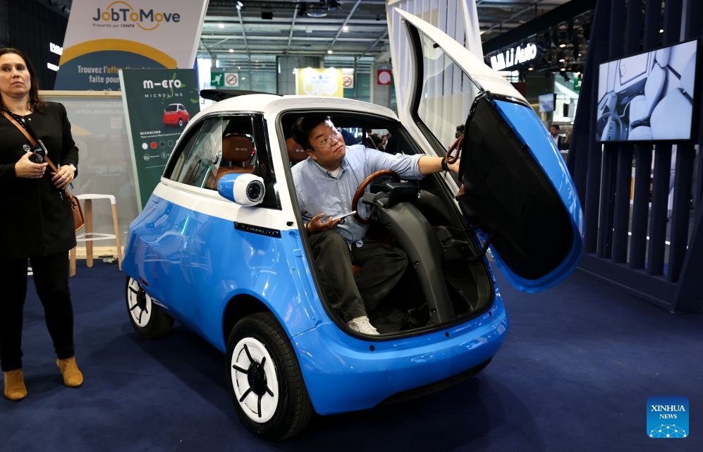 A visitor tries out a vehicle on display at the Paris Motor Show in Paris, France, Oct. 12, 2026. The 2026 Paris Motor Show kicked off here on Monday. (Photo: Xinhua)