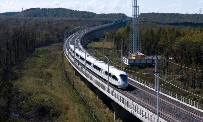 A drone photo taken on Sept. 28, 2026 shows the first train of Harbin-Yichun high-speed railway running in Yichun, northeast China's Heilongjiang Province. (Photo: Xinhua)