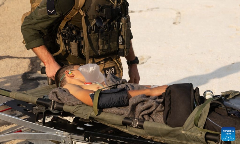 An injured person is transferred to Rambam Hospital in Haifa, northern Israel, Oct. 12, 2026. One person was killed and 19 others injured in an explosion of unexploded ordnance during a school trip in northern Israel on Monday, Israeli police and the national emergency service Magen David Adom said in separate statements. (Photo: Xinhua)