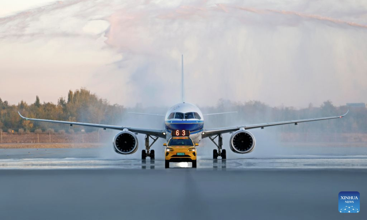 A C919 aircraft passes through a water gate at the Yinchuan Hedong International Airport in Yinchuan, northwest China's Ningxia Hui Autonomous Region, Oct. 20, 2026. China's homegrown C919 large passenger aircraft landed at the airport at 5:57 p.m. on Tuesday after departing from Changsha in central China's Hunan Province, marking the aircraft's first commercial passenger flight to Yinchuan. (Xinhua/Wang Peng)