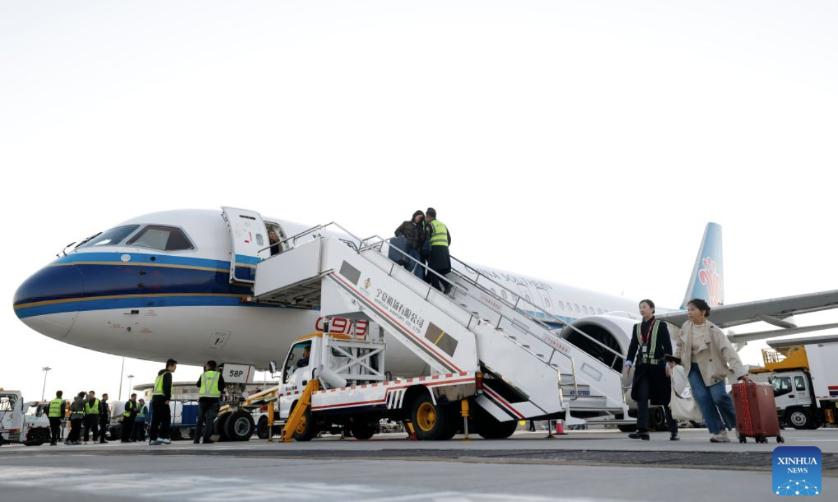 A C919 aircraft lands at the Yinchuan Hedong International Airport in Yinchuan, northwest China's Ningxia Hui Autonomous Region, Oct. 20, 2026. China's homegrown C919 large passenger aircraft landed at the airport at 5:57 p.m. on Tuesday after departing from Changsha in central China's Hunan Province, marking the aircraft's first commercial passenger flight to Yinchuan. (Xinhua/Wang Peng)