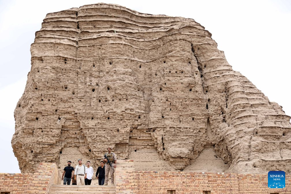 Visitors tour the grand ziggurat at the ancient site of Dur Kurigalzu in the western outskirts of Baghdad, Iraq, on October 20, 2026. Once the capital of Babylonia, Dur Kurigalzu was founded sometime around the 14th century B.C. by the Kassite King Kurigalzu I. (Photo by Khalil Dawood/Xinhua)