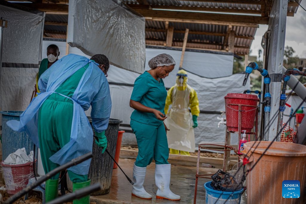 Health workers carry out disinfection work at an Ebola treatment center in Bunia, capital of Ituri Province in the Democratic Republic of the Congo (DRC), on Oct. 12, 2026. The Democratic Republic of the Congo (DRC) has recorded more than 9,000 confirmed cases of Ebola since the outbreak was declared on May 15, with the death toll rising to 4,381, according to the latest situation report released Tuesday. No vaccine or treatment has yet been specifically approved for the Bundibugyo ebolavirus, although clinical trials are underway. (Photo: Xinhua)