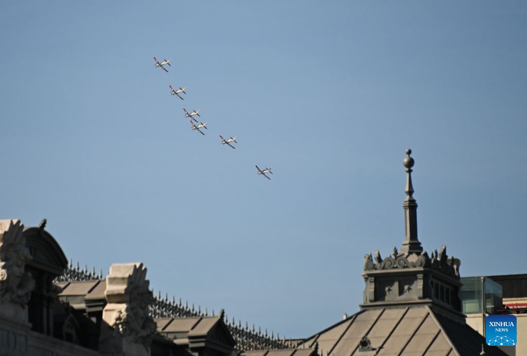 Aircraft perform during a military parade commemorating the National Day in Madrid, Spain, Oct. 12, 2026. (Photo: Xinhua)