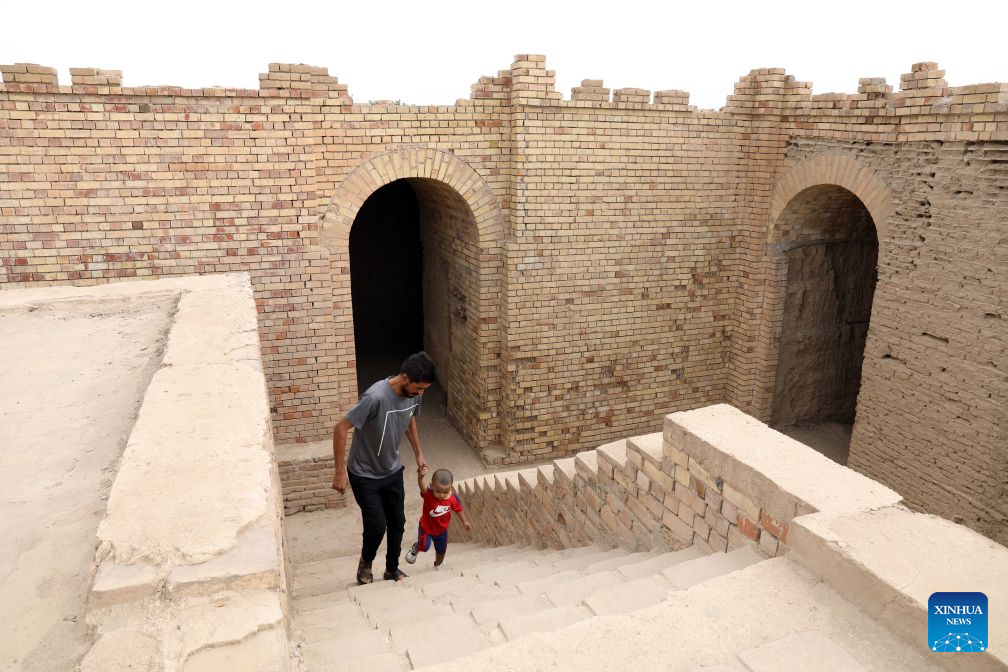 Visitors tour the grand ziggurat at the ancient site of Dur Kurigalzu in the western outskirts of Baghdad, Iraq, on October 20, 2026. Once the capital of Babylonia, Dur Kurigalzu was founded sometime around the 14th century B.C. by the Kassite King Kurigalzu I. (Photo by Khalil Dawood/Xinhua)