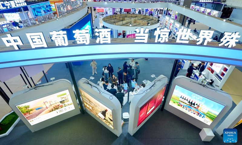 People visit the sixth China (Ningxia) International Wine Culture and Tourism Expo in Yinchuan, northwest China's Ningxia Hui Autonomous Region, Oct. 13, 2026. From Oct. 12 to 14, the expo is held in Yinchuan, attracting 84 world-renowned wineries and enterprises from distinctive production areas in 16 countries. It has also drawn a total of 146 leading domestic wineries from Ningxia and other core production areas in China. (Photo: Xinhua)