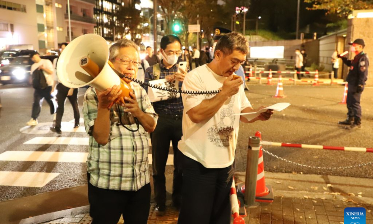 People protest during a rally in Tokyo, Japan, Oct. 20, 2026. Japanese citizens staged a protest rally in front of the Ministry of Defense in Tokyo on Tuesday evening, opposing the large-scale Japan-U.S. joint military exercises and the military buildup. (Xinhua/Li Ziyue)