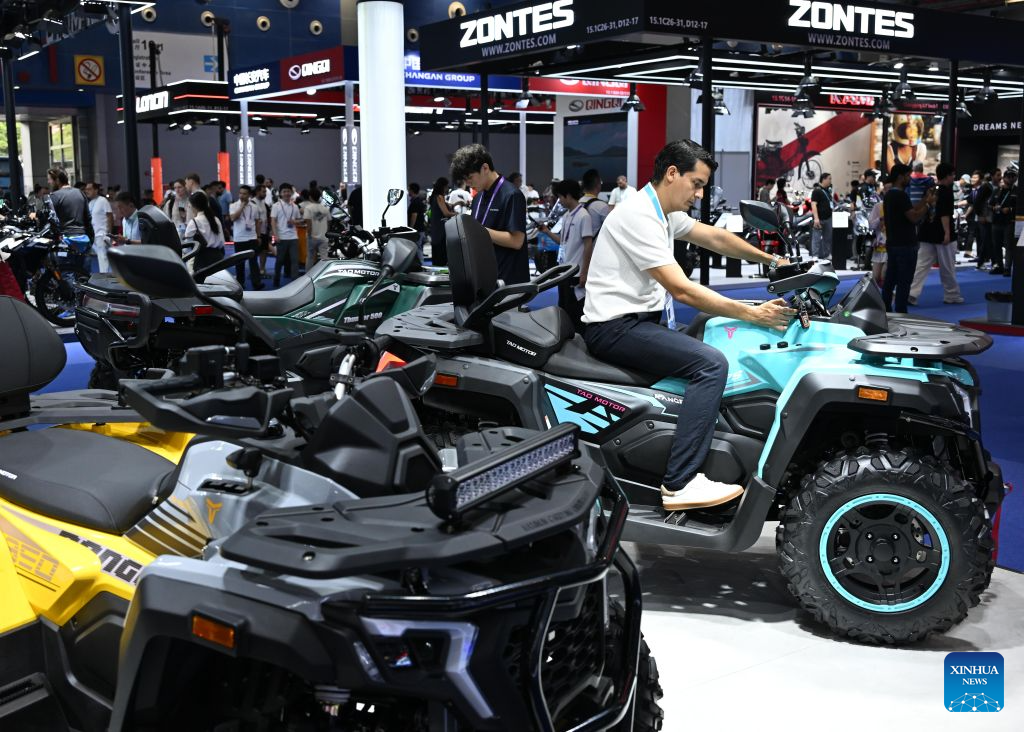 An overseas buyer experiences a motorcycle during the 140th Canton Fair in Guangzhou, south China's Guangdong Province, Oct. 18, 2026. The on-site exhibition of the first phase of the 140th edition of the China Import and Export Fair, also known as the Canton Fair, concluded here on Monday. As of October 19, the fair has attracted 189,000 overseas buyers from 214 countries and regions, a 13.3 percent increase from the session of the same period last year and a new high, according to the China Foreign Trade Centre (CFTC), the organizer of the fair. (Xinhua/Deng Hua)