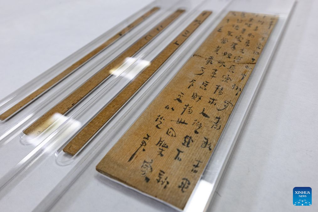 This photo taken on Oct. 19, 2026 shows a view of Han slips from Western Han Dynasty (202 BC-25 AD) after conservation treatment at the cultural relics protection center in Jingzhou, central China's Hubei Province.
Established in 2003, the cultural relics protection center in Jingzhou undertakes the conservation of about 80 percent of China's waterlogged bamboo and wooden slips. The center has developed comprehensive conservation techniques for such slips, covering sectors from archaeological excavation and laboratory conservation to display and storage.
To date, the center has provided technical support in cultural relic conservation to more than 130 cultural and museum institutions across the country, and has restored more than 10,000 lacquered wooden artifacts, over 180,000 bamboo and wooden slips, and more than 1,100 textile artifacts. (Xinhua/Xiao Yijiu)