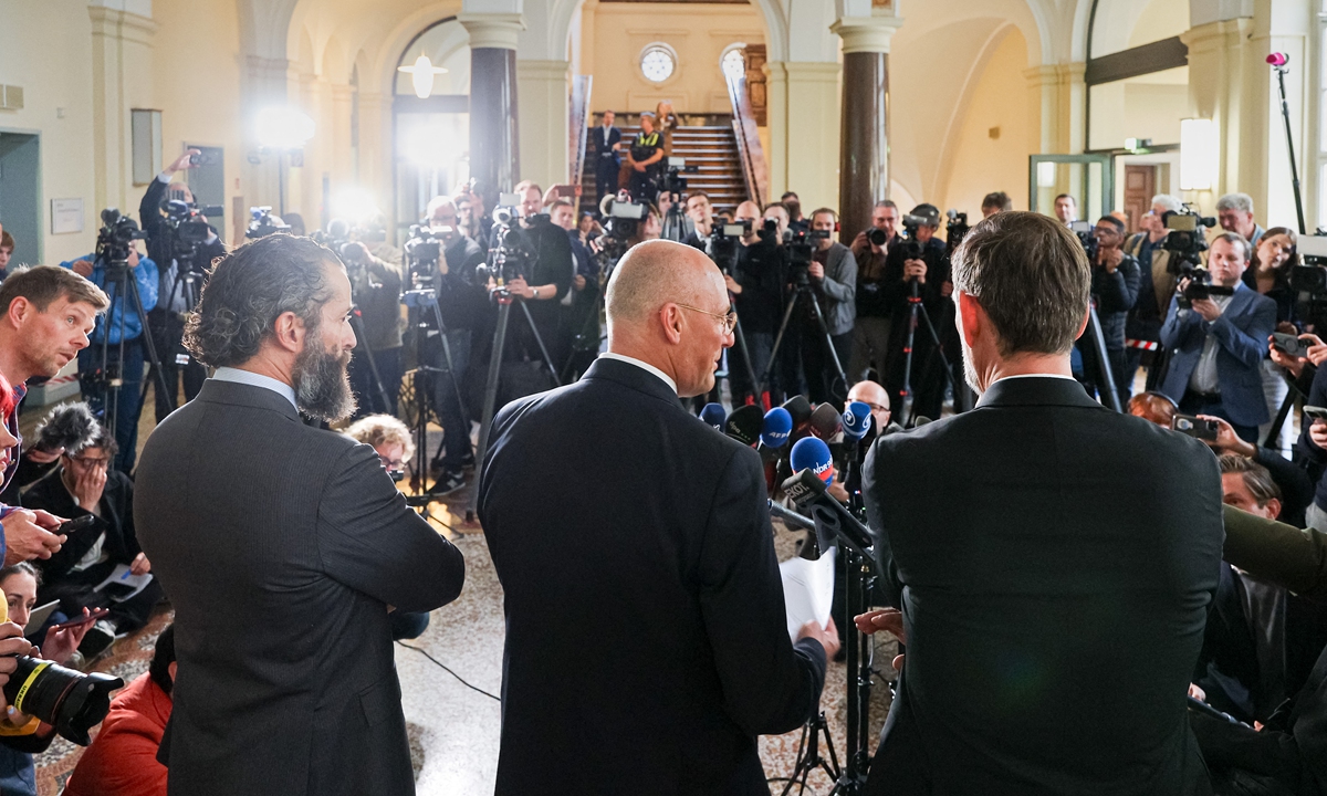 The attorneys of defendant Serhij Kusnetzow speak to press on October 14, 2026 in Hamburg, Germany after the first day of the trial on the Ukrainian national, who is alleged to have been one of the divers who attached the explosive charges to the Nord Stream pipelines in the Baltic Sea in 2022. Photo: VCG