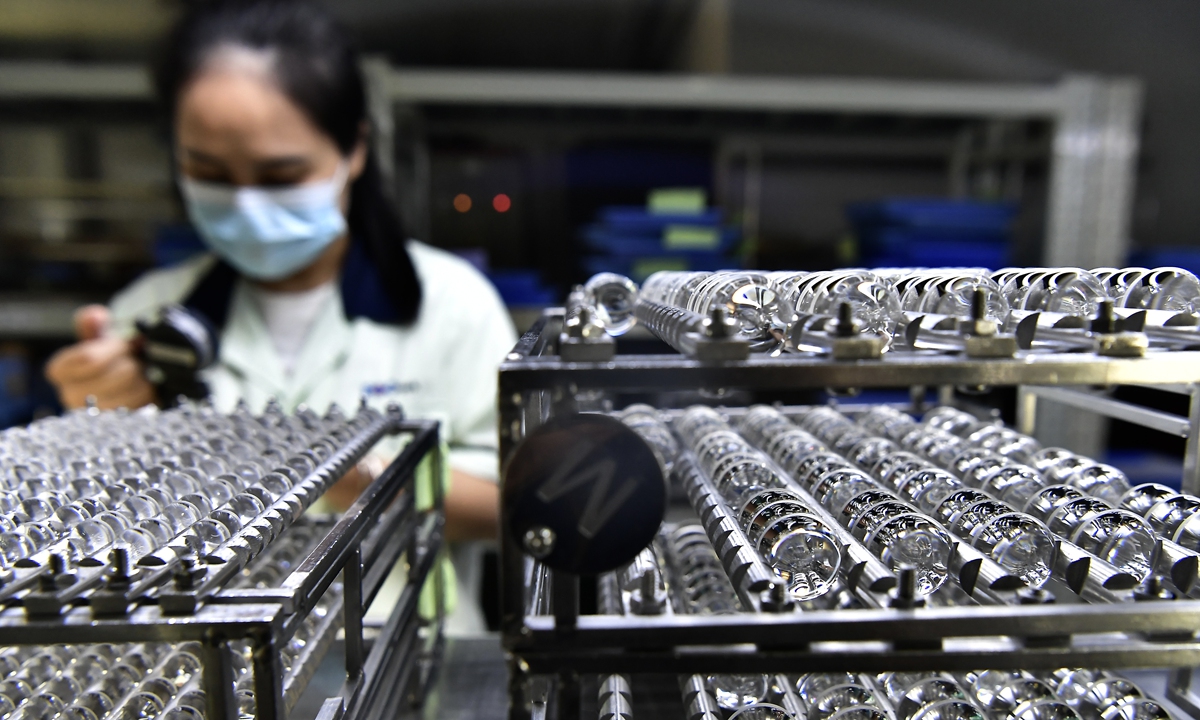 An employee works on the production line of an enterprise that makes precision optical lenses in Ninghua, East China's Fujian Province on October 14, 2026. The enterprise produces 10 million lenses and 1 million lens assemblies per month, which are widely used in instruments and meters, medical equipment and automobile manufacturing. Photo: VCG