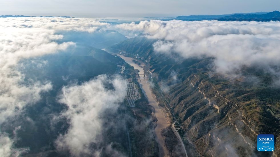 An aerial drone photo taken in Jixian County, north China's Shanxi Province on Oct. 13, 2026 shows the sea of clouds seen above the lower reaches of the Yellow River's Hukou Waterfall. (Photo: Xinhua)