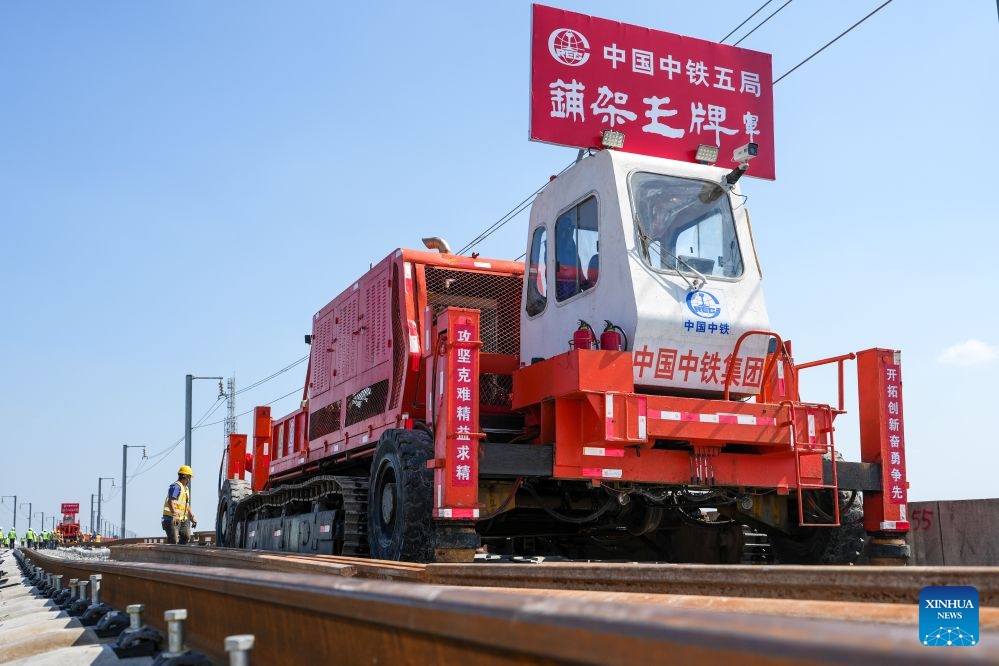 This photo taken on Oct. 14, 2026 shows constructors laying tracks on the Nantong-Ningbo high-speed railway in east China's Jiangsu Province. A high-speed railway linking Nantong of east China's Jiangsu Province with Ningbo of east China's Zhejiang Province started its track laying on Wednesday. The project is an important part of the coastal channel of China's high-speed rail network, which features eight north-south vertical lines and eight east-west horizontal lines. The new line will promote the high-quality integrated development of the Yangtze River Delta after its completion. (Photo: Xinhua)