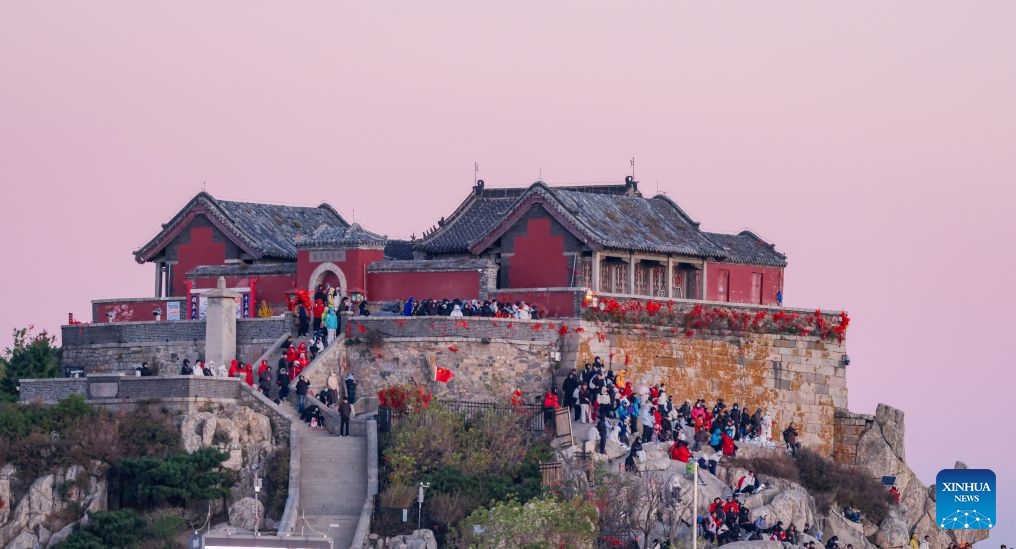 This photo taken on Oct. 8, 2026 shows tourists visiting Mount Tai in Tai'an City, east China's Shandong Province. Mount Tai, a UNESCO World Heritage Site, is one of China's most renowned mountains, known for its historical, cultural, aesthetic, and scientific significance. (Photo: Xinhua)